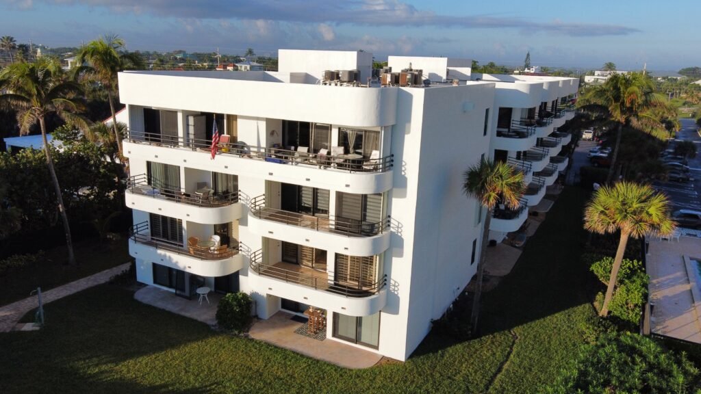 Freshly painted waterfront condominium building with balconies
