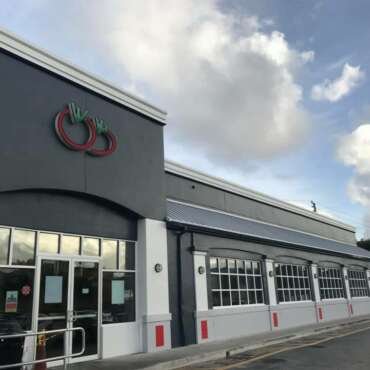 Repainted retail storefront with a charcoal facade